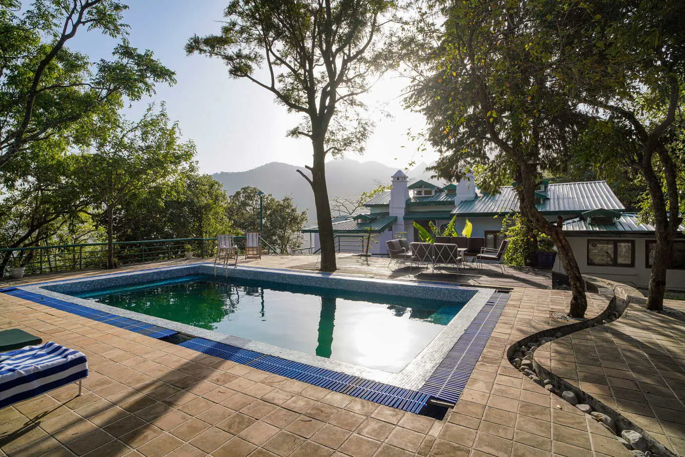 Swimming pool deck with mountain views at Two Chimneys, Gethia near Nainital